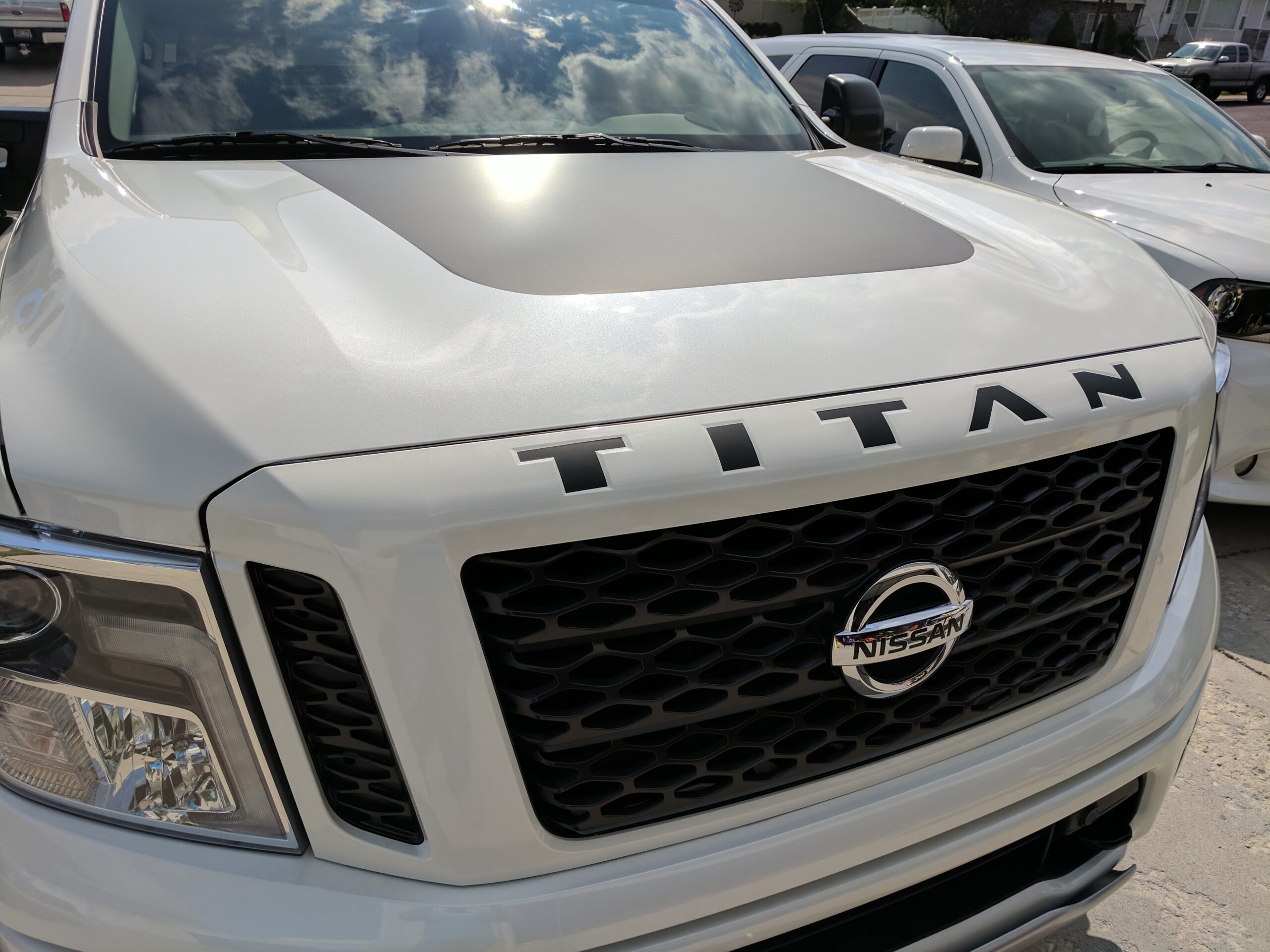 Gloss Black Vinyl Overlay Decals For Nissan Titan Door Emblems – 2016-2021 – Blackout Auto Mods